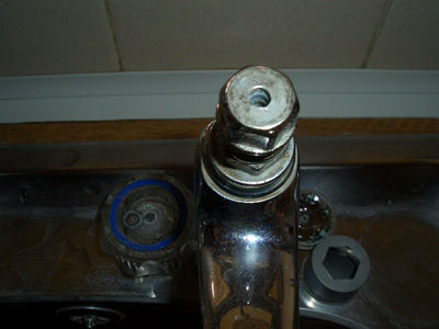 tap with handle removed to reveal washer