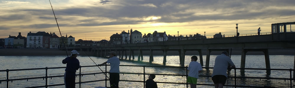 Group fishing on Deal Pier